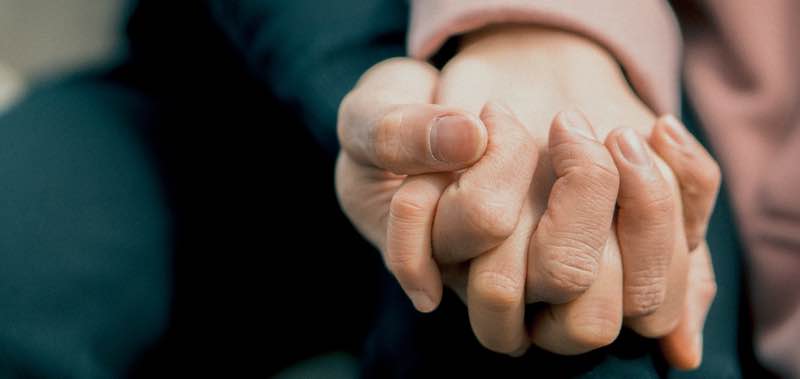holding hands with caregiver